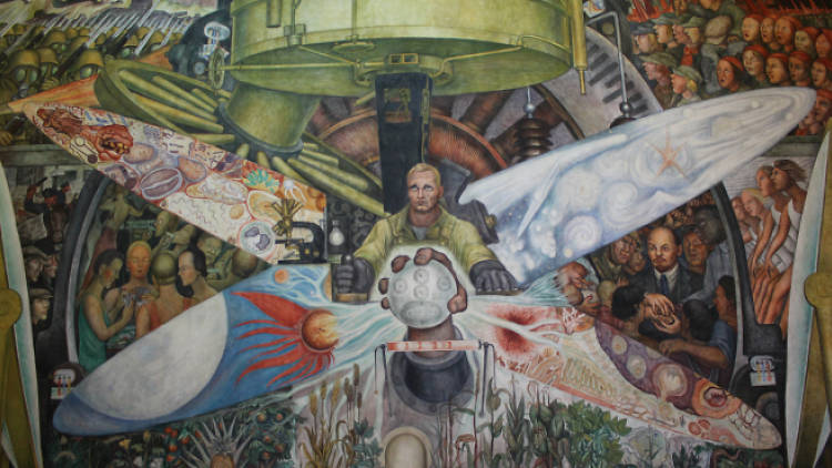 Marvel at the murals in the Palace of Fine Arts